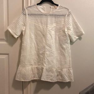 Woman’s orange creek top